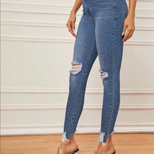 Ripped dark blue denim skinny jeans